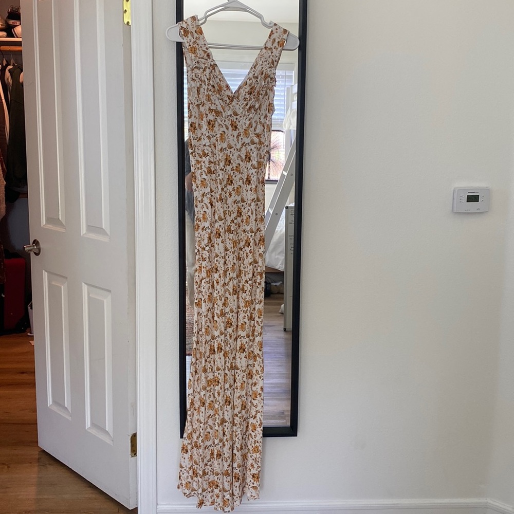 Beautiful dress! Perfect for summer. Warn once. Great neckline in front & back!